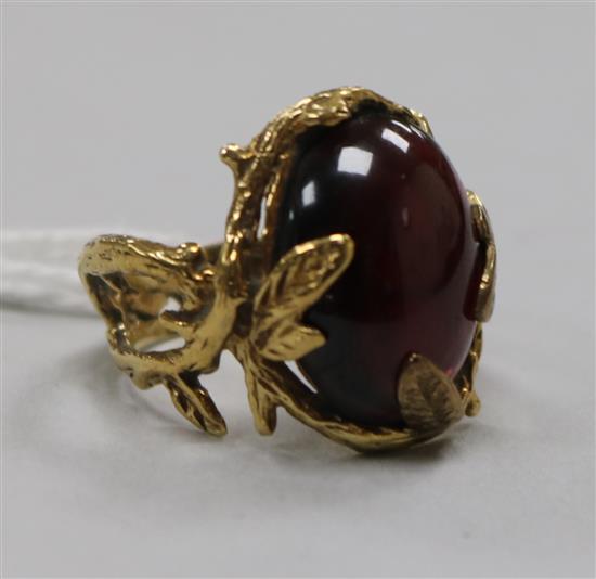 A 9ct gold and cabochon garnet set ring with rustic shank, maker HB, size N.